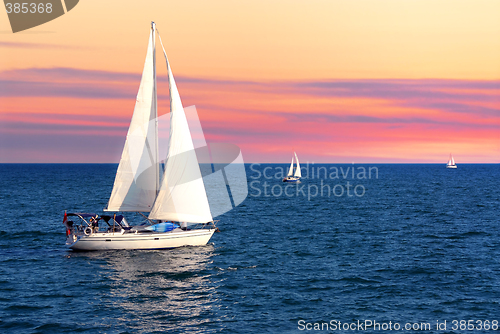 Image of Sailboats at sunset