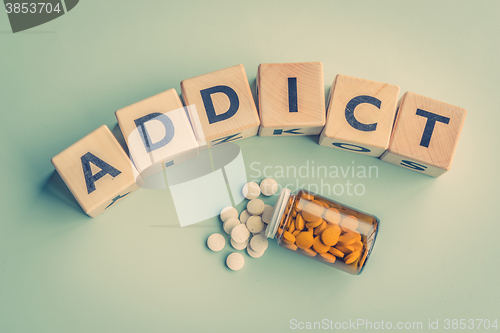 Image of The word addict on a table