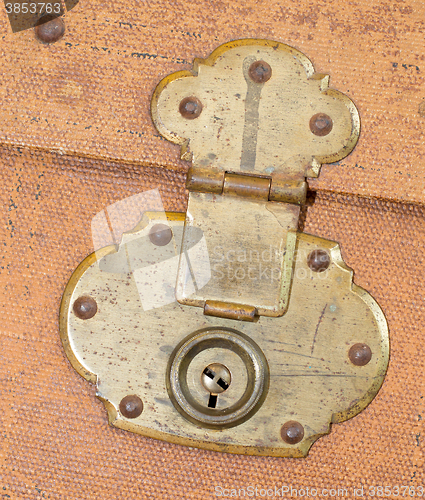 Image of Old canvas trunk lock close up