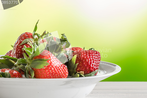 Image of Red strawberries on a white plate