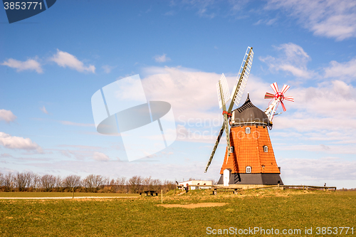 Image of Mill on a green meadow in the spring