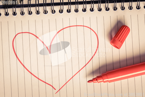 Image of Red heart and a marker