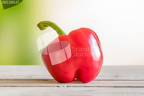 Image of Red pepper on a wooden table