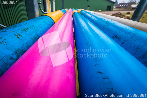 Image of Colorful pipes at a farm