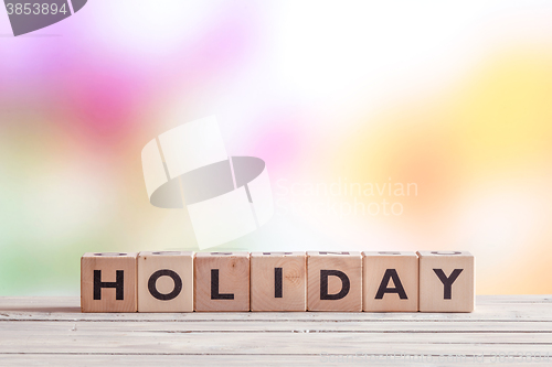 Image of Holiday sign on a wooden table