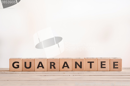 Image of Guarantee sign on a wooden desk