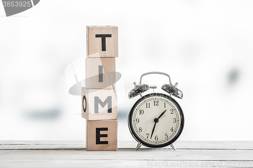 Image of Time concept with a clock and a word