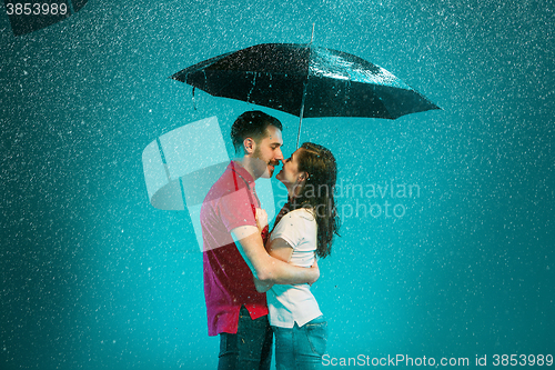 Image of The loving couple in the rain