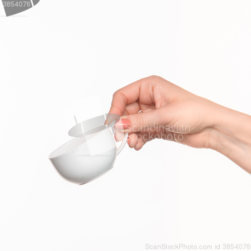 Image of Woman hand with cup on white background