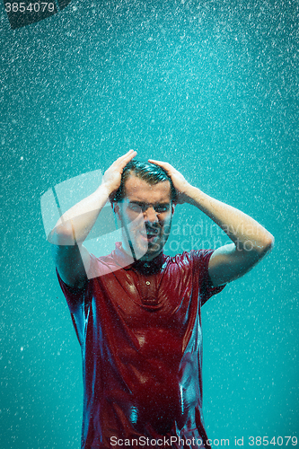 Image of The portrait of young man in the rain