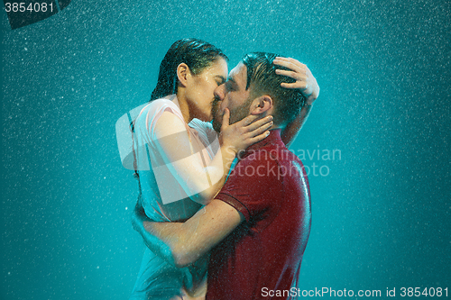 Image of The loving couple in the rain