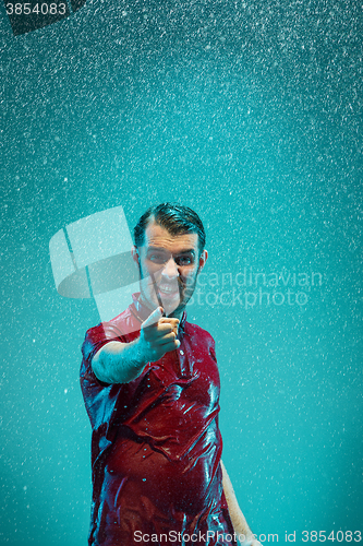 Image of The portrait of young man in the rain