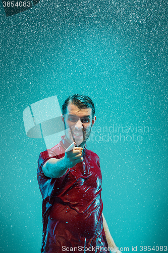 Image of The portrait of young man in the rain