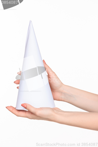 Image of The cone in female hands on white background