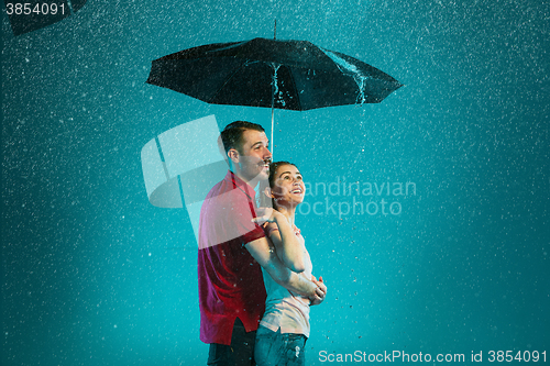 Image of The loving couple in the rain