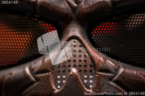 Image of Steel mask covered with rust closeup