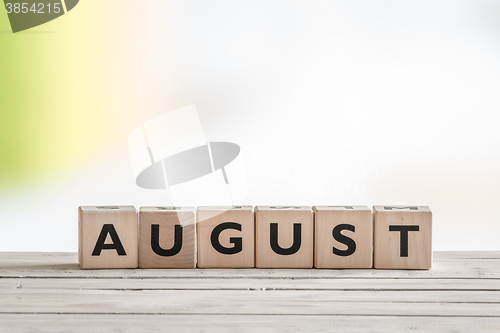 Image of August sign on wooden cubes