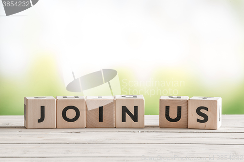 Image of Join us sign on wooden cubes