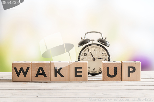 Image of Wake up message with a classic alarm clock