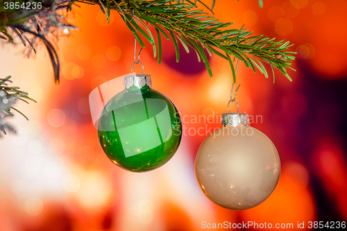 Image of Christmas baubles on a pine branch