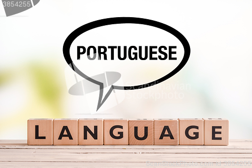 Image of Portuguese language lesson sign on a table