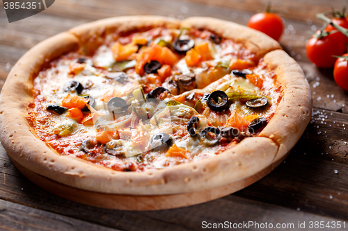 Image of Pizza with tomato, mushroom and olives