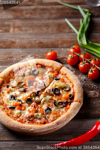 Image of Pizza with tomato, mushroom and olives