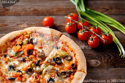 Image of Pizza with tomato, mushroom and olives
