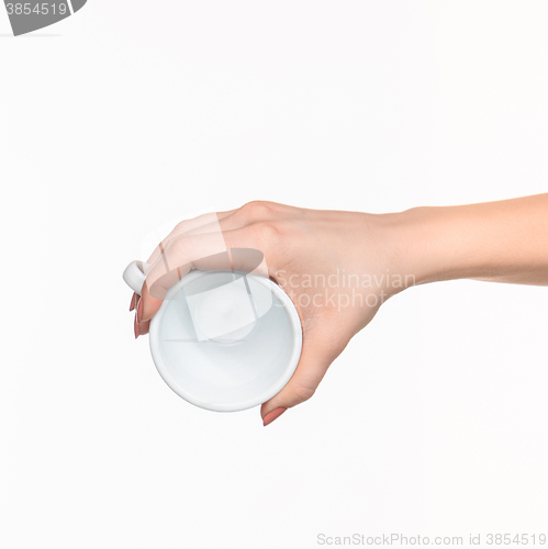 Image of Woman hand with cup on white background