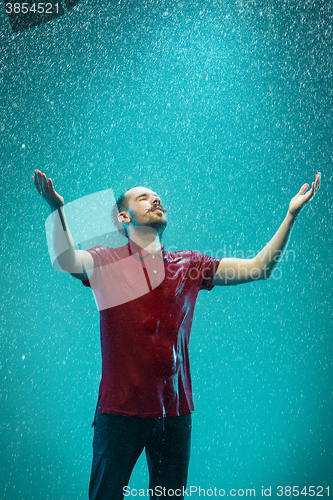 Image of The portrait of young man in the rain