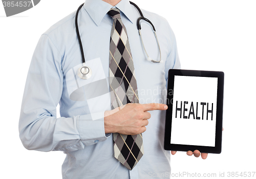 Image of Doctor holding tablet - Health