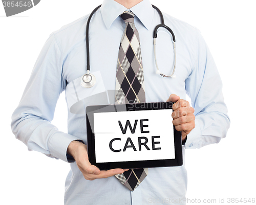 Image of Doctor holding tablet - We care