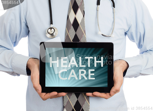 Image of Doctor holding tablet - Healthcare