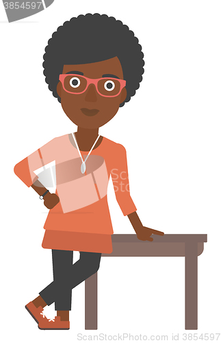 Image of Woman leaning on table.