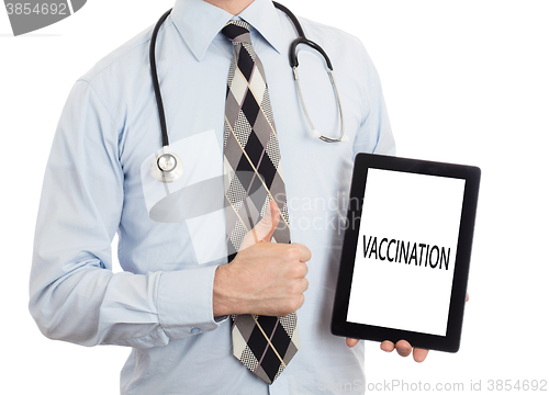 Image of Doctor holding tablet - Vaccination