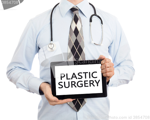 Image of Doctor holding tablet - Plastic surgery