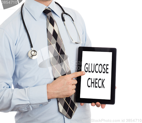 Image of Doctor holding tablet - Glucose check