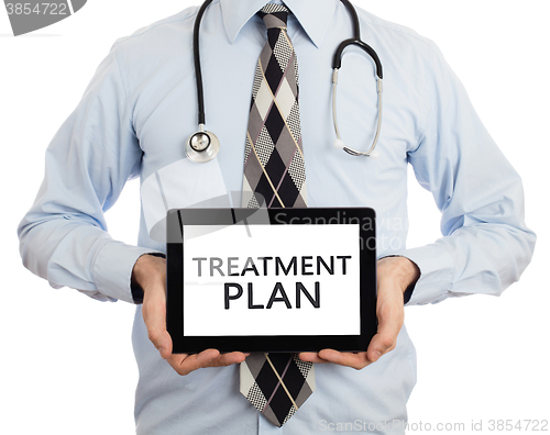 Image of Doctor holding tablet - Treatment plan