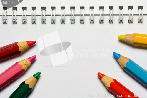 Image of Color pencils on a notepad

