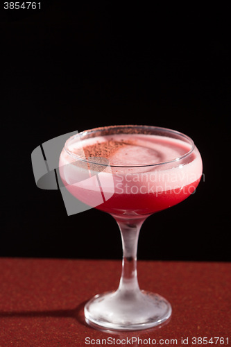 Image of glass with the red cocktail