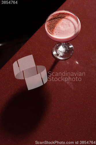 Image of glass with the red cocktail