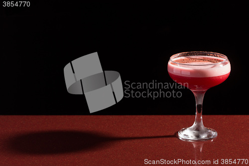 Image of glass with the red cocktail