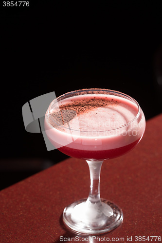 Image of glass with the red cocktail