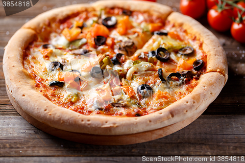 Image of Pizza with tomato, mushroom and olives