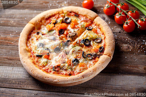 Image of Pizza with tomato, mushroom and olives