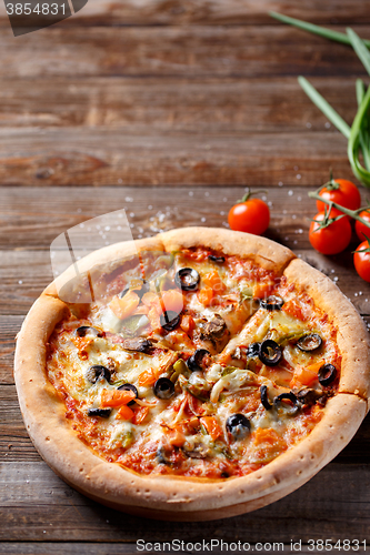 Image of Pizza with tomato, mushroom and olives