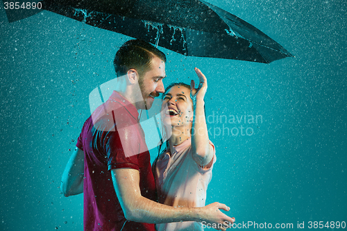 Image of The loving couple in the rain