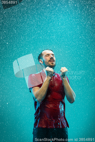 Image of The portrait of young man in the rain