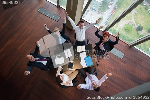 Image of happy business people group on meeting at modern office