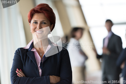 Image of portrait of  red hair  senior  business woman